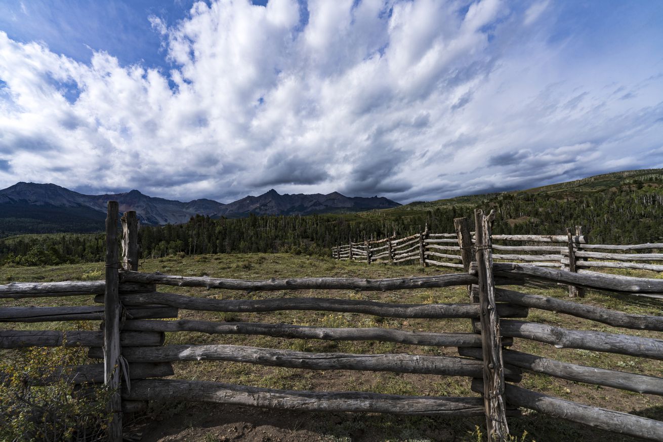 horse corral on Double RL Ranch looks at San Juan Mountains in classic cowboy setting