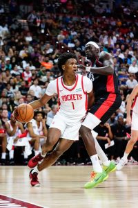 Jul 7, 2023; Las Vegas, NV, USA; Houston Rockets guard Amen Thompson (1) drives the ball against Portland Trail Blazers center Duop Reath (68) during the second half at Thomas & Mack Center. Mandatory Credit: Lucas Peltier-USA TODAY Sports. Thompson looks to help Houston take a big step this season