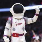 Houston Rockets mascot Dunkstronaut throws shirts to the crowd