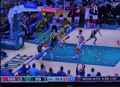 Giannis standing uncalled out of bounds starting a fast break.